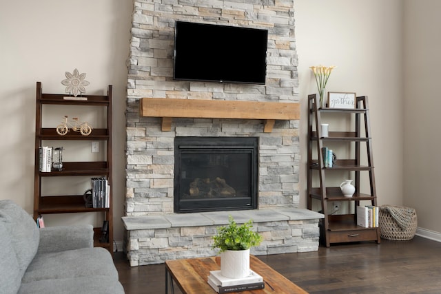 3669 Audubon Ave, Hilliard, OH 43026 - living area featuring a stone fireplace, wood finished floors, and baseboards
