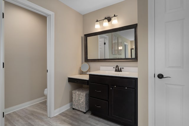 3669 Audubon Ave, Hilliard, OH 43026 - bathroom featuring toilet, wood finished floors, vanity, and baseboards