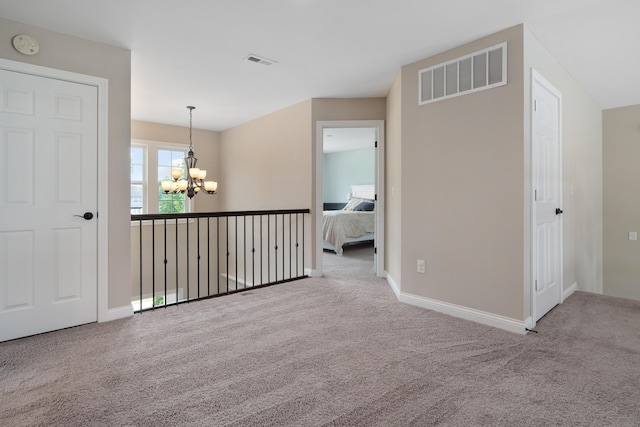 3669 Audubon Ave, Hilliard, OH 43026 - carpeted empty room with a chandelier, a smoke detector, and baseboards