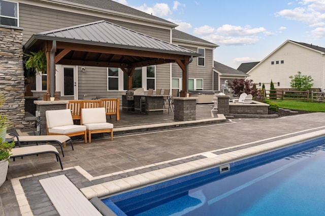 3669 Audubon Ave, Hilliard, OH 43026 - back of house featuring an outdoor kitchen, a gazebo, an outdoor pool, and a patio area