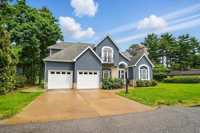 9146 Shawnee Trl, Powell, OH 43065 - traditional-style home featuring stone siding, stucco siding, a front lawn, and a garage