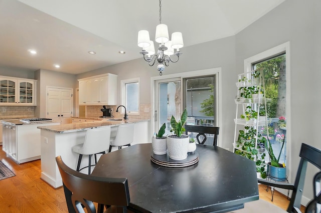 9146 Shawnee Trl, Powell, OH 43065 - dining space with light wood-type flooring, recessed lighting, and a chandelier