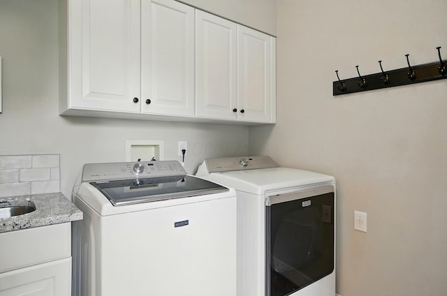 9146 Shawnee Trl, Powell, OH 43065 - washroom featuring washing machine and dryer and cabinet space