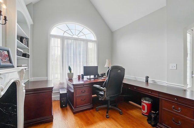 9146 Shawnee Trl, Powell, OH 43065 - office area featuring vaulted ceiling and light wood-style flooring