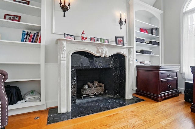 9146 Shawnee Trl, Powell, OH 43065 - detailed view of wood finished floors, a high end fireplace, and built in features