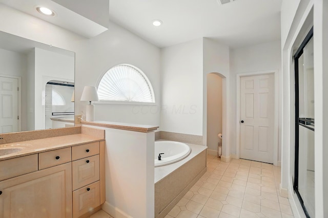 9146 Shawnee Trl, Powell, OH 43065 - bathroom featuring a bath, vanity, tile patterned flooring, recessed lighting, and a shower with door