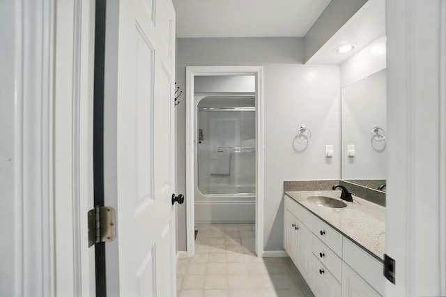 9146 Shawnee Trl, Powell, OH 43065 - bathroom featuring vanity, enclosed tub / shower combo, tile patterned flooring, and baseboards