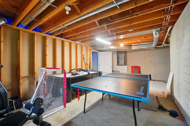 9146 Shawnee Trl, Powell, OH 43065 - recreation room with electric panel, brick wall, and concrete flooring