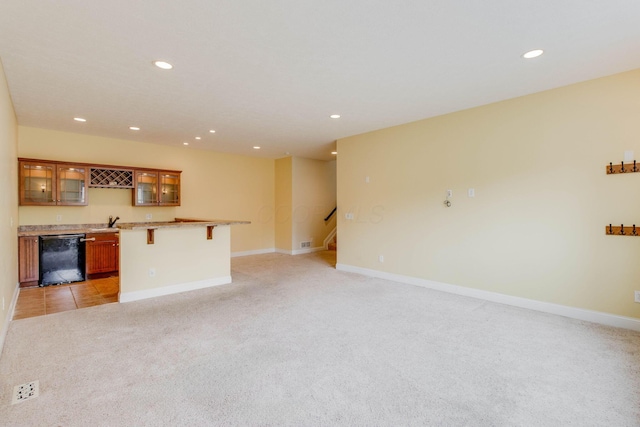 2898 Braden Way, Blacklick, OH 43004 - unfurnished living room with light carpet, wet bar, recessed lighting, baseboards, and stairs