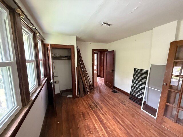 778 Berkeley Rd, Columbus, OH 43205 - empty room featuring wood finished floors, a heating unit, and baseboards