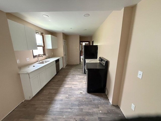 778 Berkeley Rd, Columbus, OH 43205 - kitchen featuring range, a sink, stainless steel dishwasher, white cabinetry, and recessed lighting