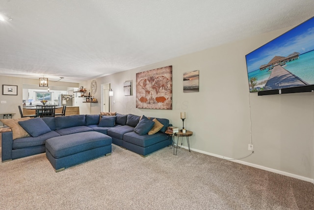 3137 Griggsview Ct Unit 3137, Columbus, OH 43221 - carpeted living area featuring baseboards and a chandelier