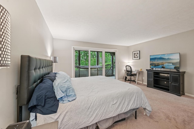 3137 Griggsview Ct Unit 3137, Columbus, OH 43221 - bedroom featuring access to outside, carpet, and baseboards
