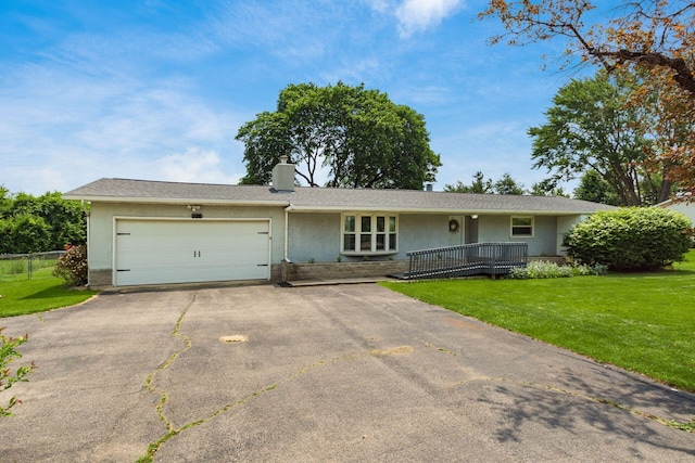 776 Galloway Rd, Galloway, OH 43119 - ranch-style home featuring a garage, asphalt driveway, a front yard, and stucco siding
