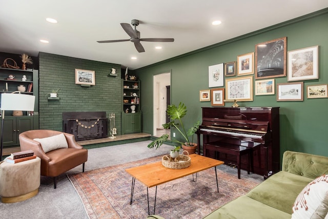 776 Galloway Rd, Galloway, OH 43119 - carpeted living area featuring a ceiling fan, a brick fireplace, recessed lighting, built in features, and crown molding