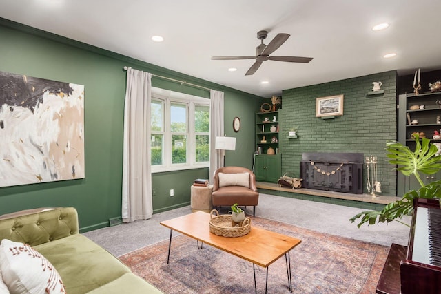 776 Galloway Rd, Galloway, OH 43119 - living area featuring a ceiling fan, a brick fireplace, recessed lighting, crown molding, and baseboards