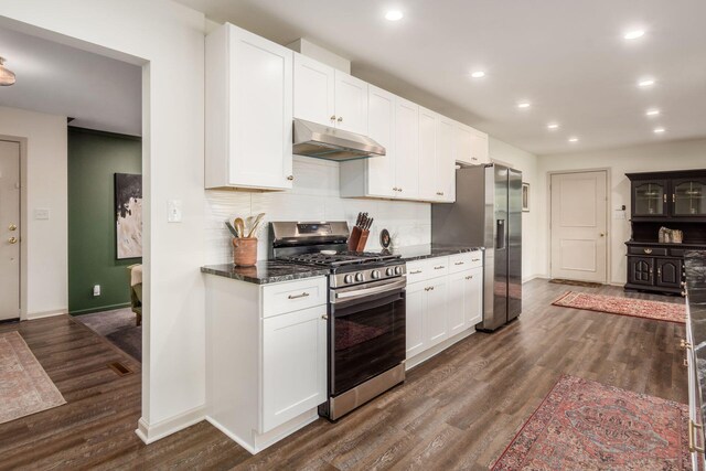 776 Galloway Rd, Galloway, OH 43119 - kitchen featuring stainless steel appliances, under cabinet range hood, baseboards, backsplash, and dark wood finished floors