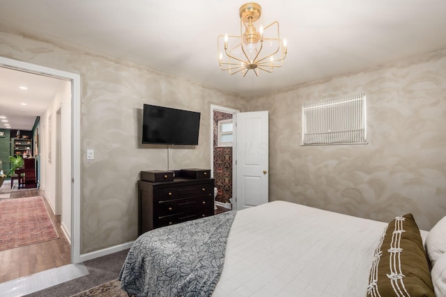 776 Galloway Rd, Galloway, OH 43119 - bedroom featuring a chandelier, baseboards, wallpapered walls, and carpet floors