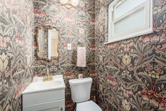 776 Galloway Rd, Galloway, OH 43119 - bathroom with wallpapered walls, vanity, and toilet