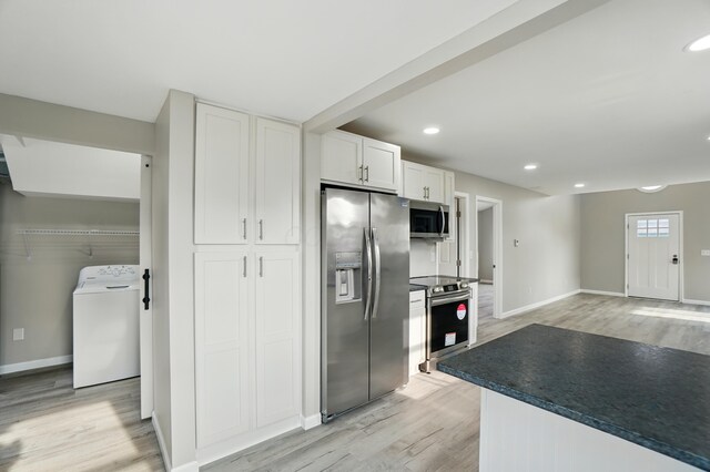 4881 Decker Ave NE, Thornville, OH 43076 - kitchen with appliances with stainless steel finishes, washer / dryer, light wood-type flooring, white cabinets, and recessed lighting