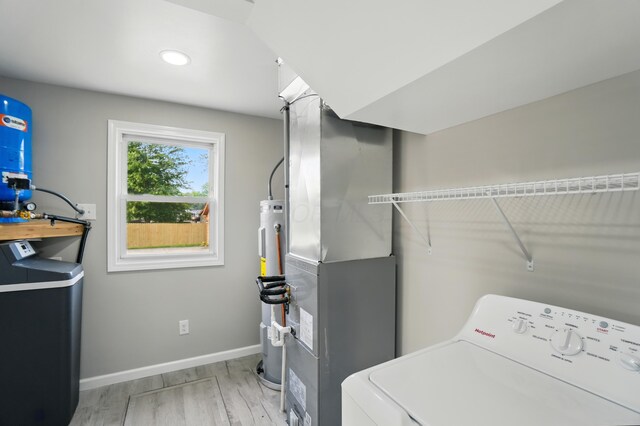 4881 Decker Ave NE, Thornville, OH 43076 - laundry area featuring washer / clothes dryer, light wood-type flooring, baseboards, heating unit, and recessed lighting