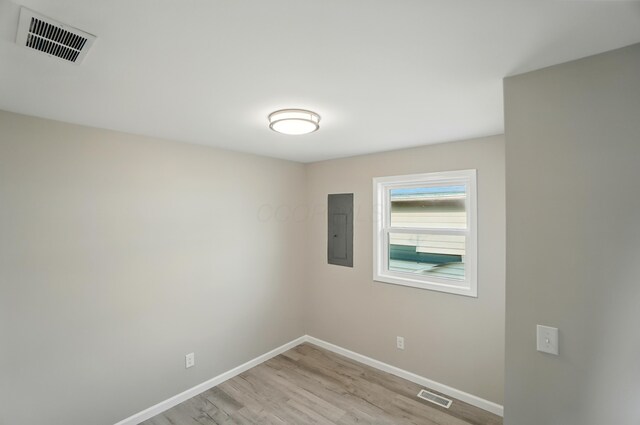 4881 Decker Ave NE, Thornville, OH 43076 - spare room with electric panel, baseboards, and light wood finished floors