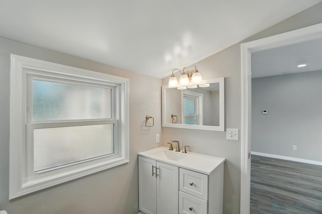4881 Decker Ave NE, Thornville, OH 43076 - bathroom featuring vanity, wood finished floors, baseboards, and a chandelier
