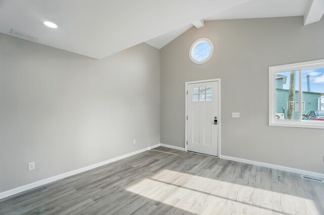 4881 Decker Ave NE, Thornville, OH 43076 - foyer entrance featuring baseboards, wood finished floors, beamed ceiling, and high vaulted ceiling
