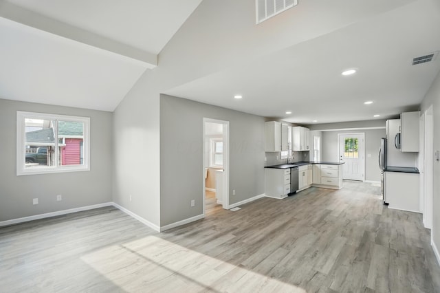 4881 Decker Ave NE, Thornville, OH 43076 - kitchen with light wood-type flooring, dishwasher, baseboards, dark countertops, and white cabinetry