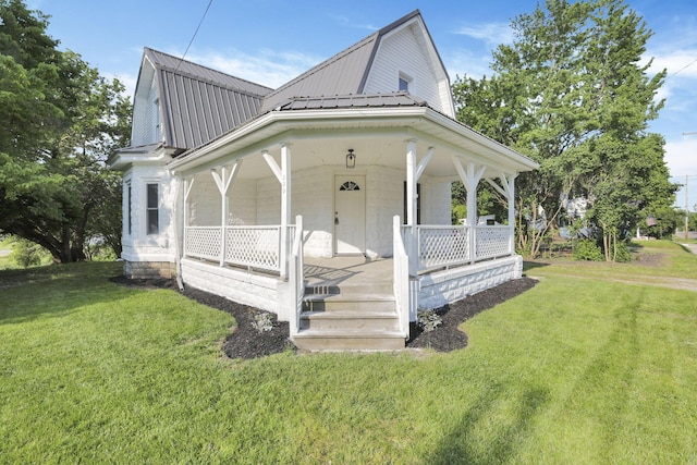 800 S Detroit St, Bellefontaine, OH 43311 - farmhouse inspired home with a gambrel roof, a porch, a front yard, and metal roof