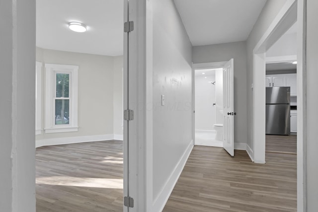 800 S Detroit St, Bellefontaine, OH 43311 - corridor featuring wood finished floors and baseboards