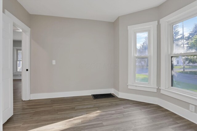 800 S Detroit St, Bellefontaine, OH 43311 - spare room with baseboards and wood finished floors