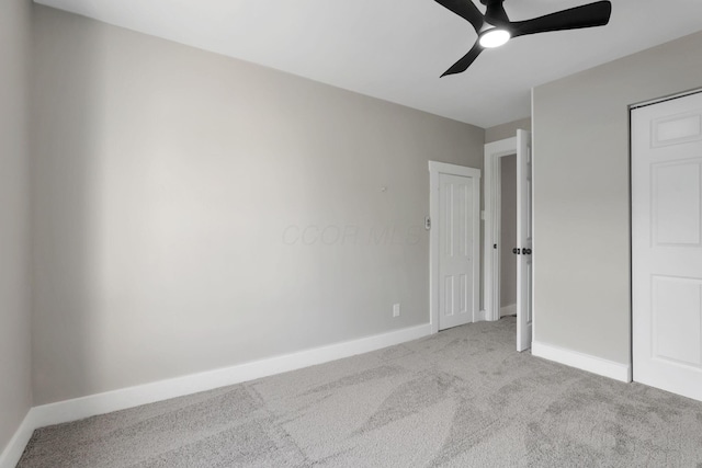 800 S Detroit St, Bellefontaine, OH 43311 - unfurnished bedroom featuring carpet, baseboards, and a ceiling fan