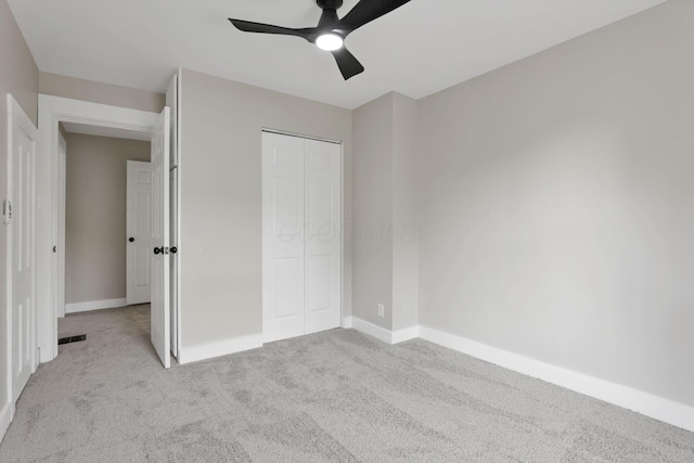 800 S Detroit St, Bellefontaine, OH 43311 - unfurnished bedroom featuring carpet flooring, a closet, ceiling fan, and baseboards
