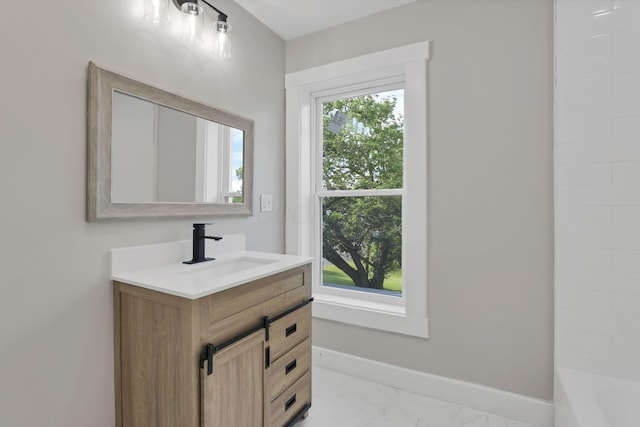 800 S Detroit St, Bellefontaine, OH 43311 - bathroom featuring vanity, baseboards, and marble finish flooring