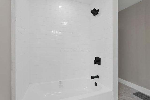 800 S Detroit St, Bellefontaine, OH 43311 - bathroom featuring tile patterned flooring, tub / shower combination, and baseboards