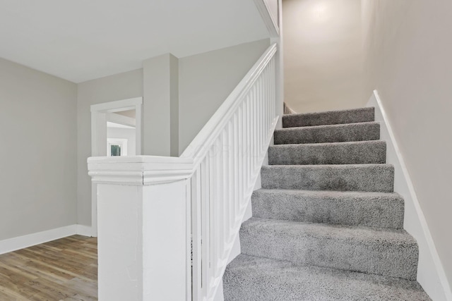 800 S Detroit St, Bellefontaine, OH 43311 - stairway featuring wood finished floors and baseboards
