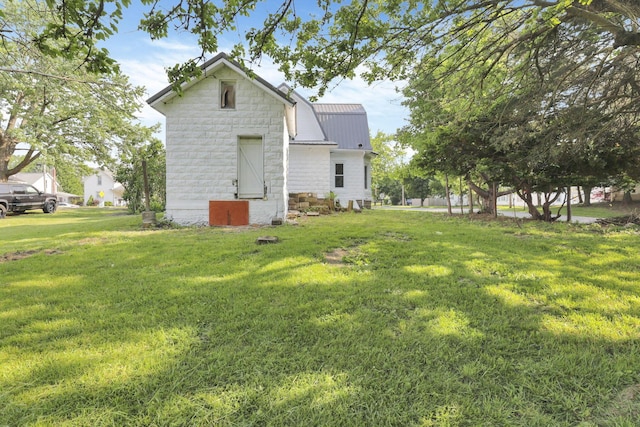 800 S Detroit St, Bellefontaine, OH 43311 - back of house featuring a lawn and metal roof