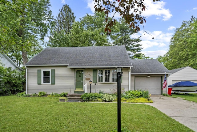 2107 Radnor Ave, Columbus, OH 43224 - cape cod-style house featuring an attached garage, a front yard, concrete driveway, and a shingled roof