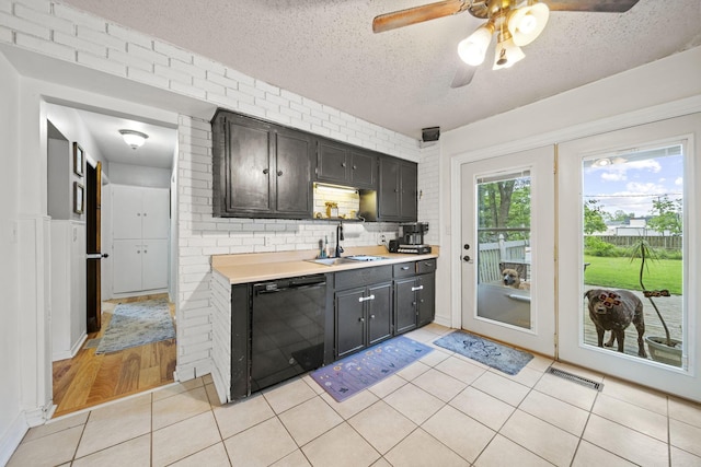 2107 Radnor Ave, Columbus, OH 43224 - kitchen with dishwasher, a sink, light countertops, a textured ceiling, and a ceiling fan