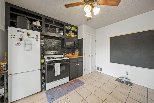 2107 Radnor Ave, Columbus, OH 43224 - kitchen featuring white appliances, backsplash, ceiling fan, a textured ceiling, and light tile patterned flooring