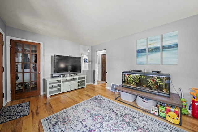 2107 Radnor Ave, Columbus, OH 43224 - living room featuring wood finished floors and baseboards