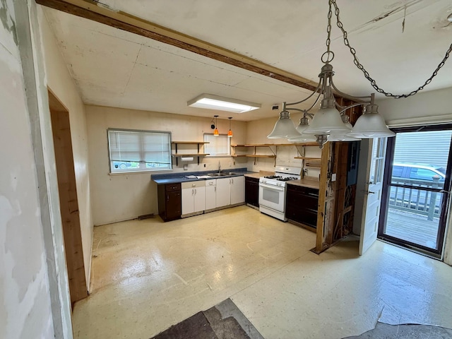 120 Chandler Ave, London, OH 43140 - kitchen featuring white gas range, open shelves, plenty of natural light, and a sink