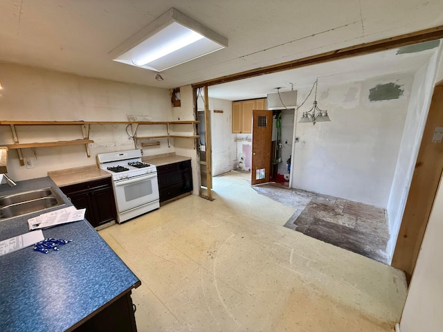 120 Chandler Ave, London, OH 43140 - kitchen featuring white gas stove, open shelves, and a sink