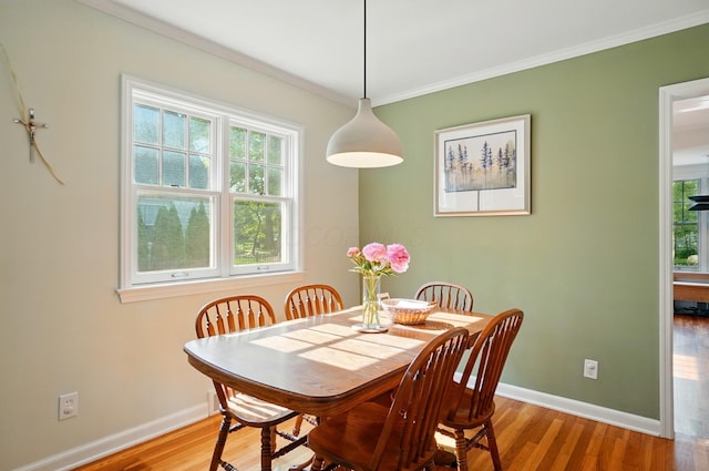 91 Nottingham Rd, Columbus, OH 43214 - dining area featuring crown molding, baseboards, and wood finished floors