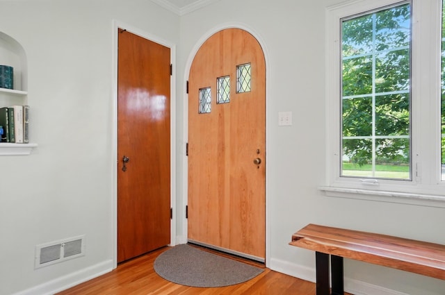 91 Nottingham Rd, Columbus, OH 43214 - foyer entrance with light wood-style floors, ornamental molding, and baseboards