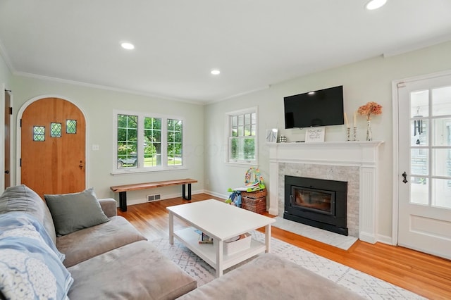 91 Nottingham Rd, Columbus, OH 43214 - living area featuring ornamental molding, healthy amount of natural light, wood finished floors, a premium fireplace, and baseboards