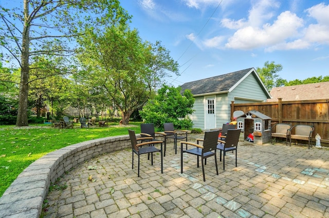 91 Nottingham Rd, Columbus, OH 43214 - view of patio with an outdoor fire pit and an outdoor structure