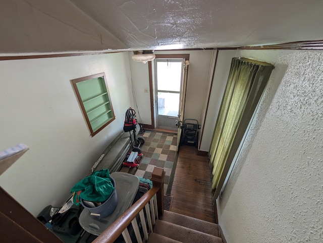 54 W High St, Mount Gilead, OH 43338 - stairway featuring a textured wall and wood finished floors