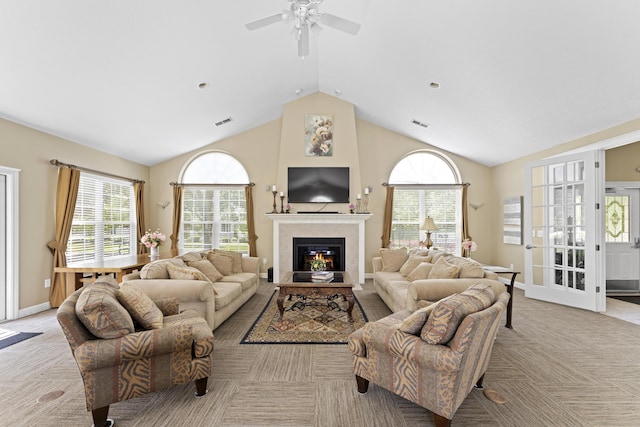 200 Jamie Lynn Cir, Pickerington, OH 43147 - living area featuring a glass covered fireplace, lofted ceiling, light colored carpet, ceiling fan, and plenty of natural light